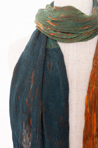 Neeru Kumar pure silk shibori pleat scarf in deep green and gold.