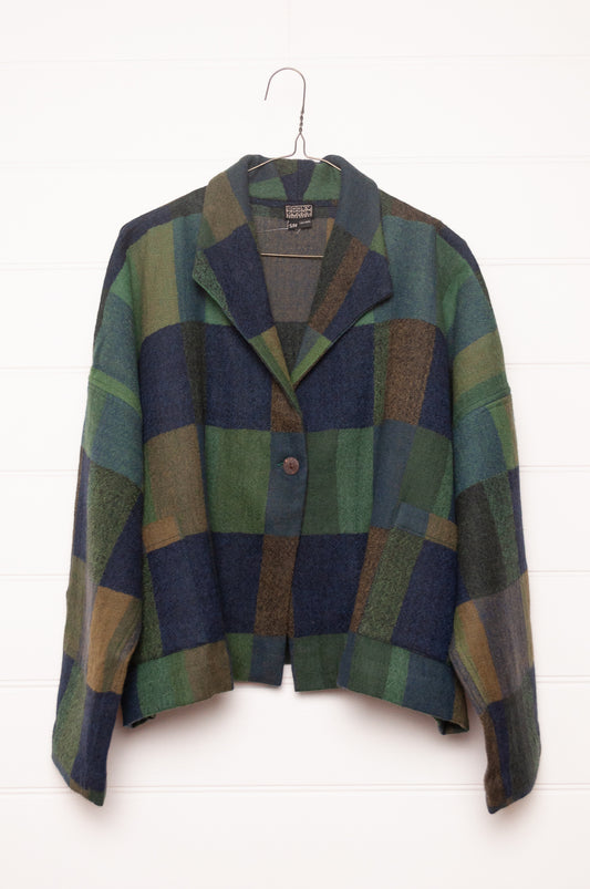 Neeru Kumar handwoven wool blanket check cropped loose fit jacket in indigo navy and emerald green.