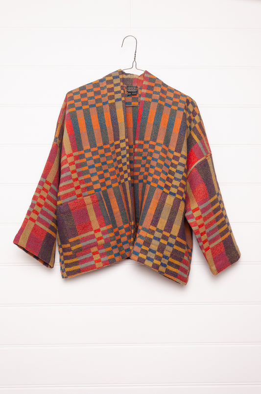 Neeru Kumar handwoven wool check kimono cropped jacket in olive, red, orange, mustard and charcoal.