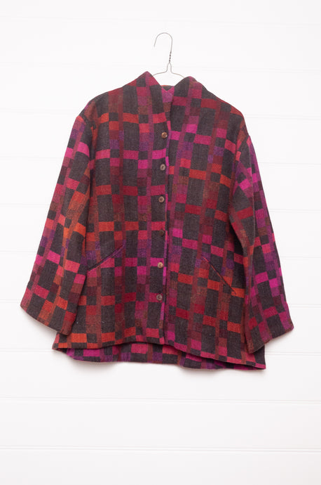 Neeru Kumar handwoven wool button up jacket in magenta, red and charcoal check.