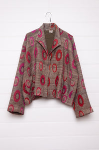 Neeru Kumar handwoven wool silk lined loose fitting jacket in coffee brown with red, magenta and pink circles.