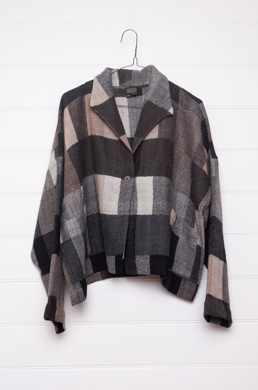 Neeru Kumar Coco jacket in blanket check wool, monochrome tones of charcoal, black, beige, latte and brown.