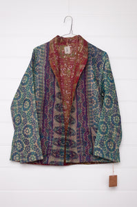 Dve one of a kind reversible silk kantha Neeli jacket in patchwork of teal floral and navy paisley, with rust and ecru vintage print on the reverse.