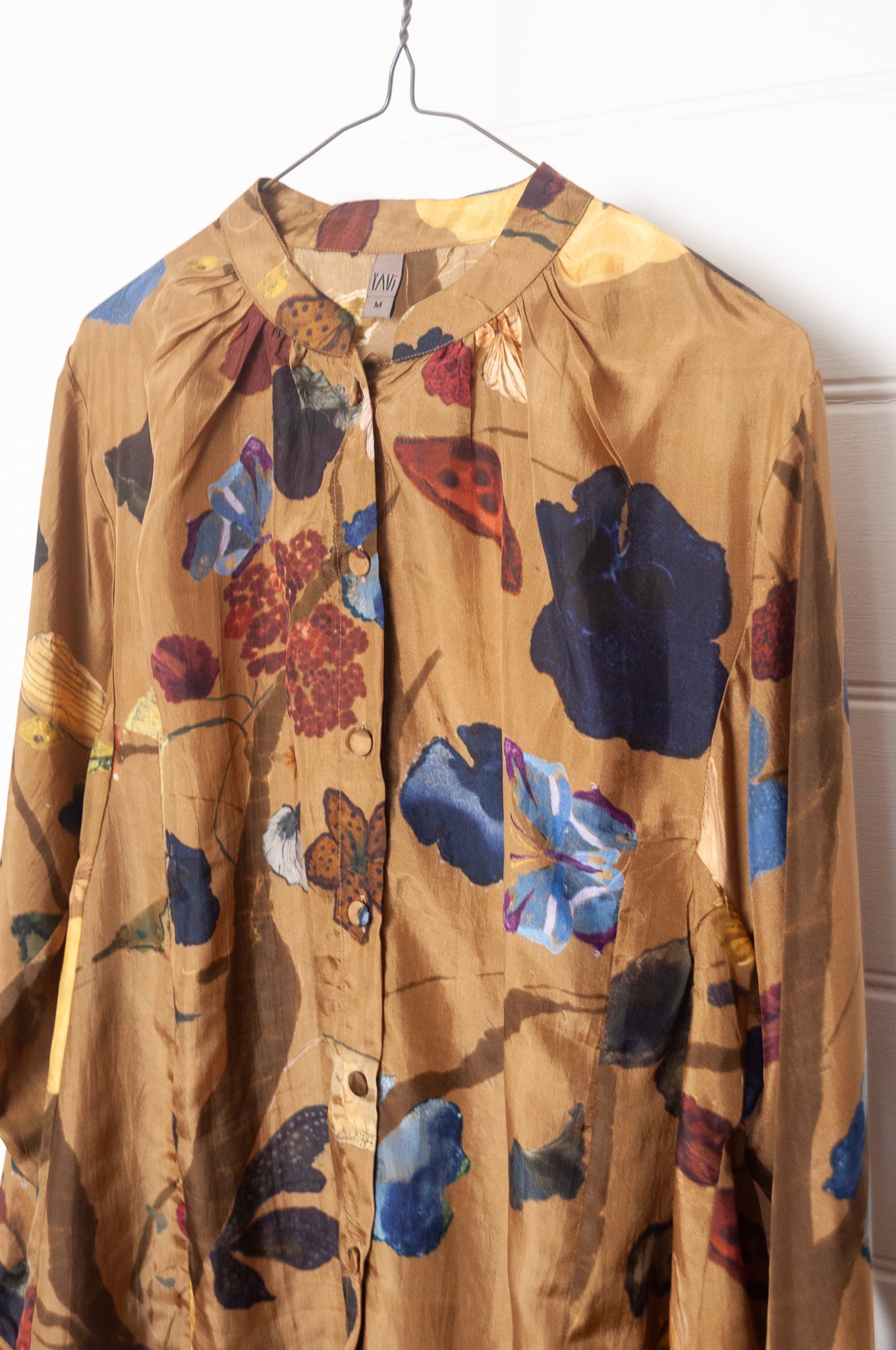 Yavi Tawny silk blouse in Vine garden print on mustard.