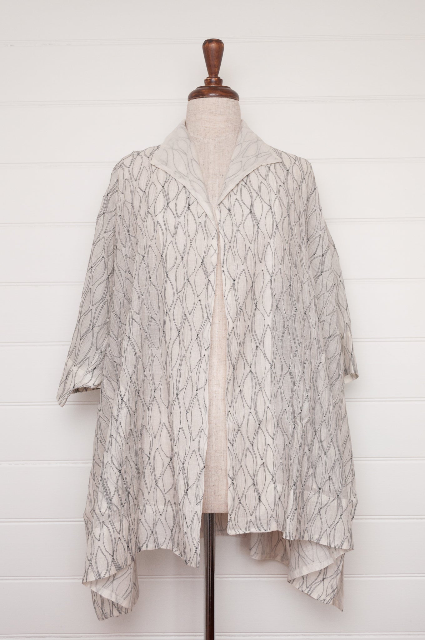 Classic Neeru Kumar cotton silk oversized kimono jacket in white, with black embroidery and unlined.