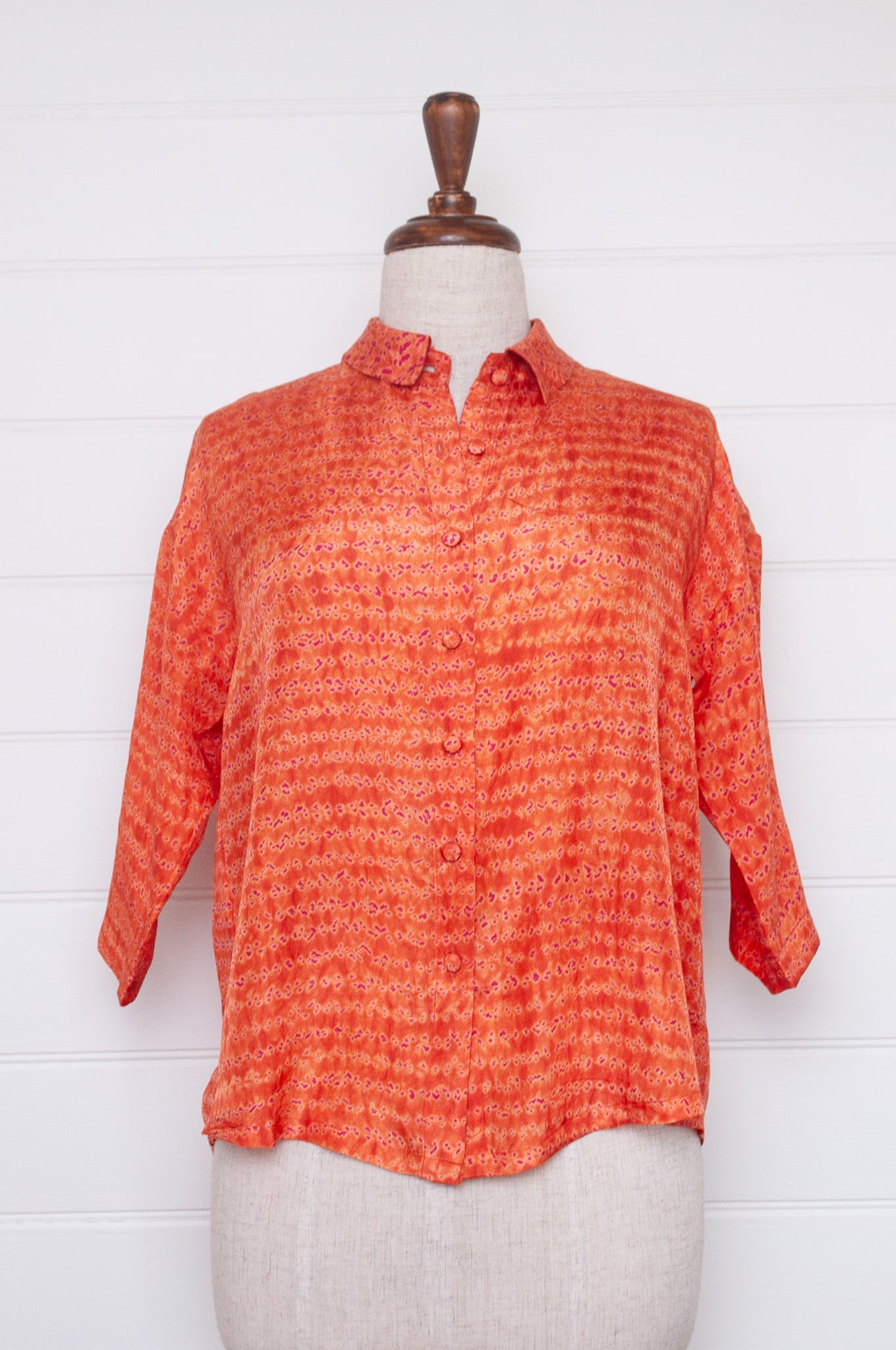 Neeru Kumar coral and pink silk shibori short sleeve blouse.