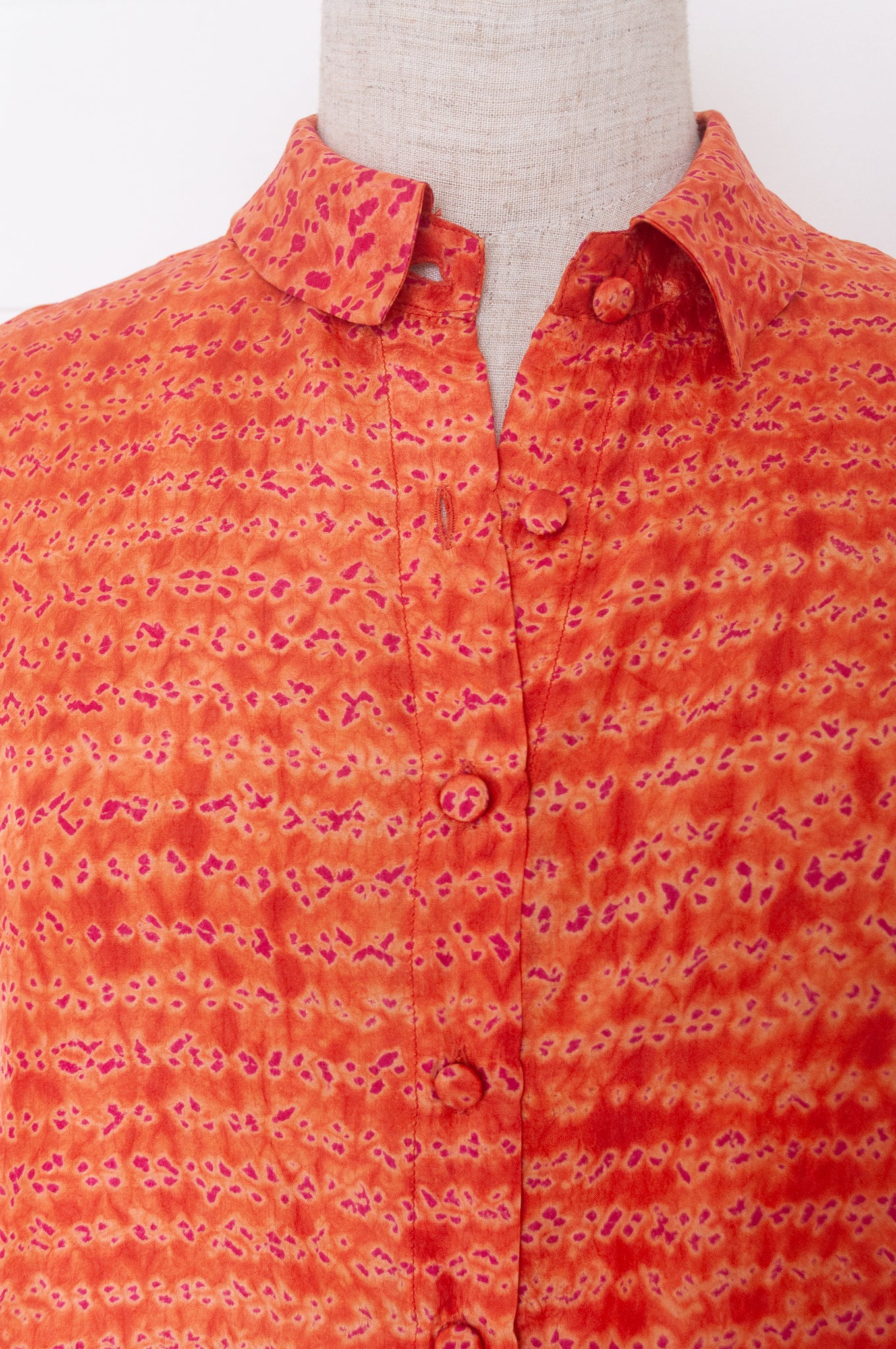 Neeru Kumar coral and pink silk shibori short sleeve blouse.