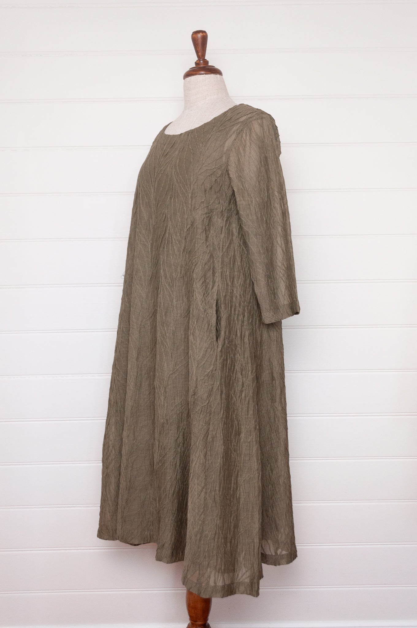 Neeru Kumar silk cotton embroidered dress in olive green.