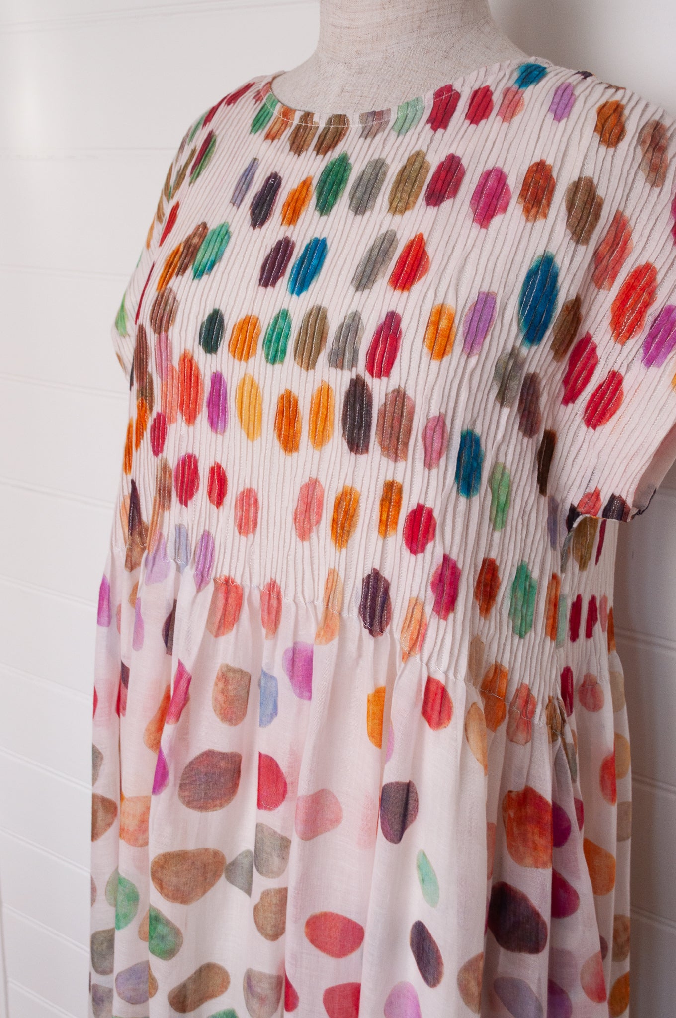 Neeru Kumar fine cotton sun dress with pintucked bodice and cap sleeves. Large multi coloured spots on white.