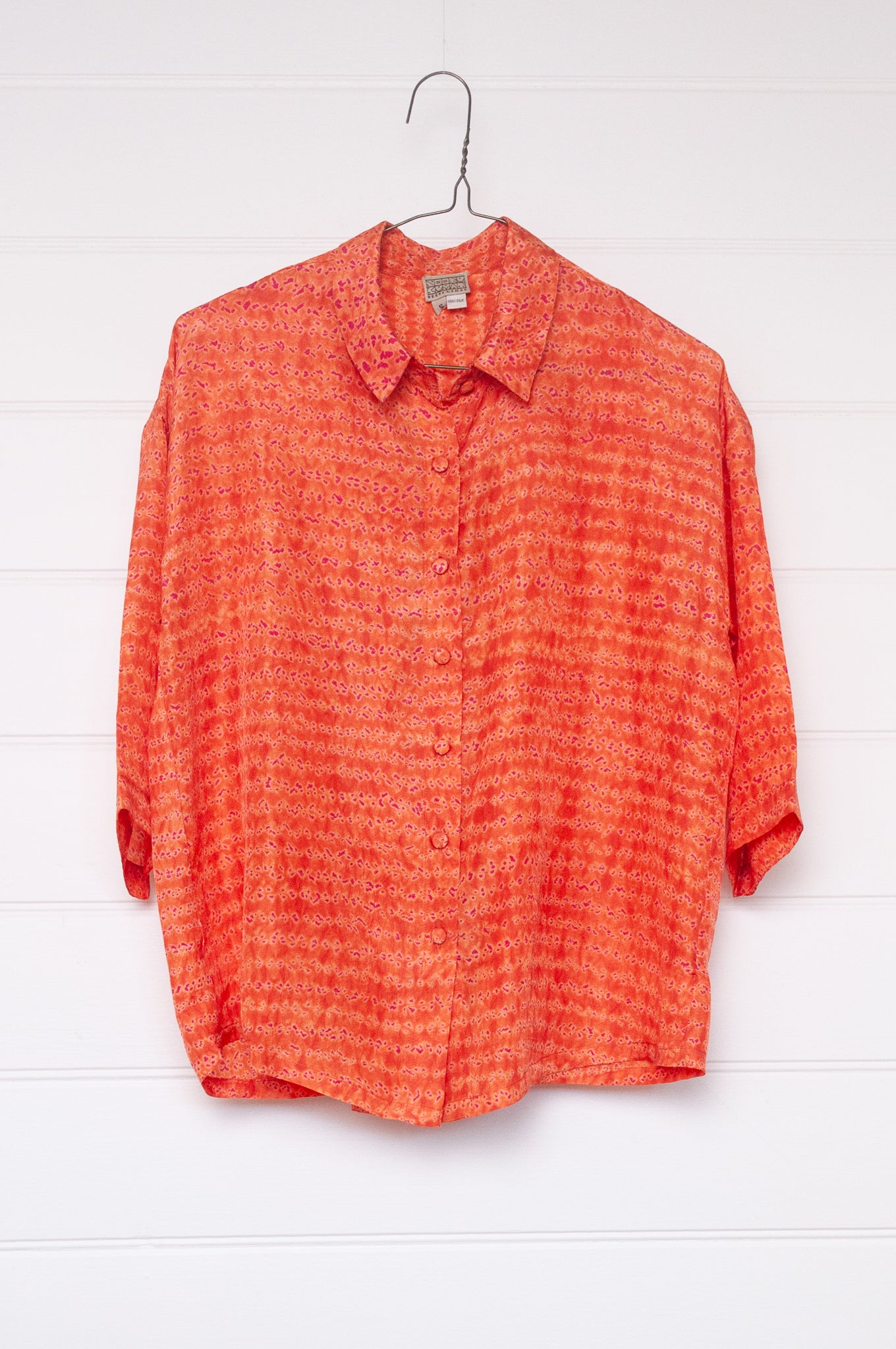 Neeru Kumar coral and pink silk shibori short sleeve blouse.