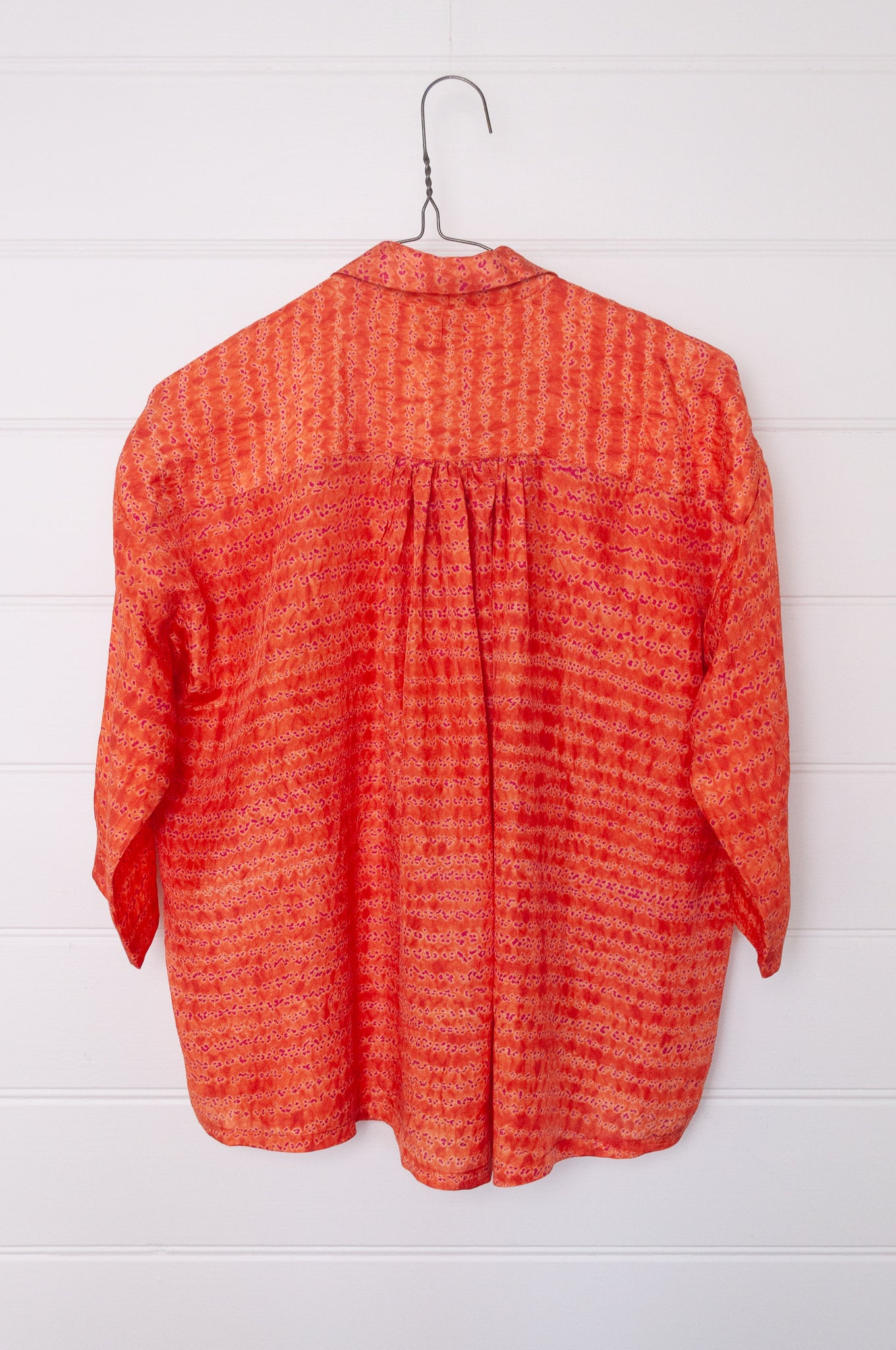Neeru Kumar coral and pink silk shibori short sleeve blouse.