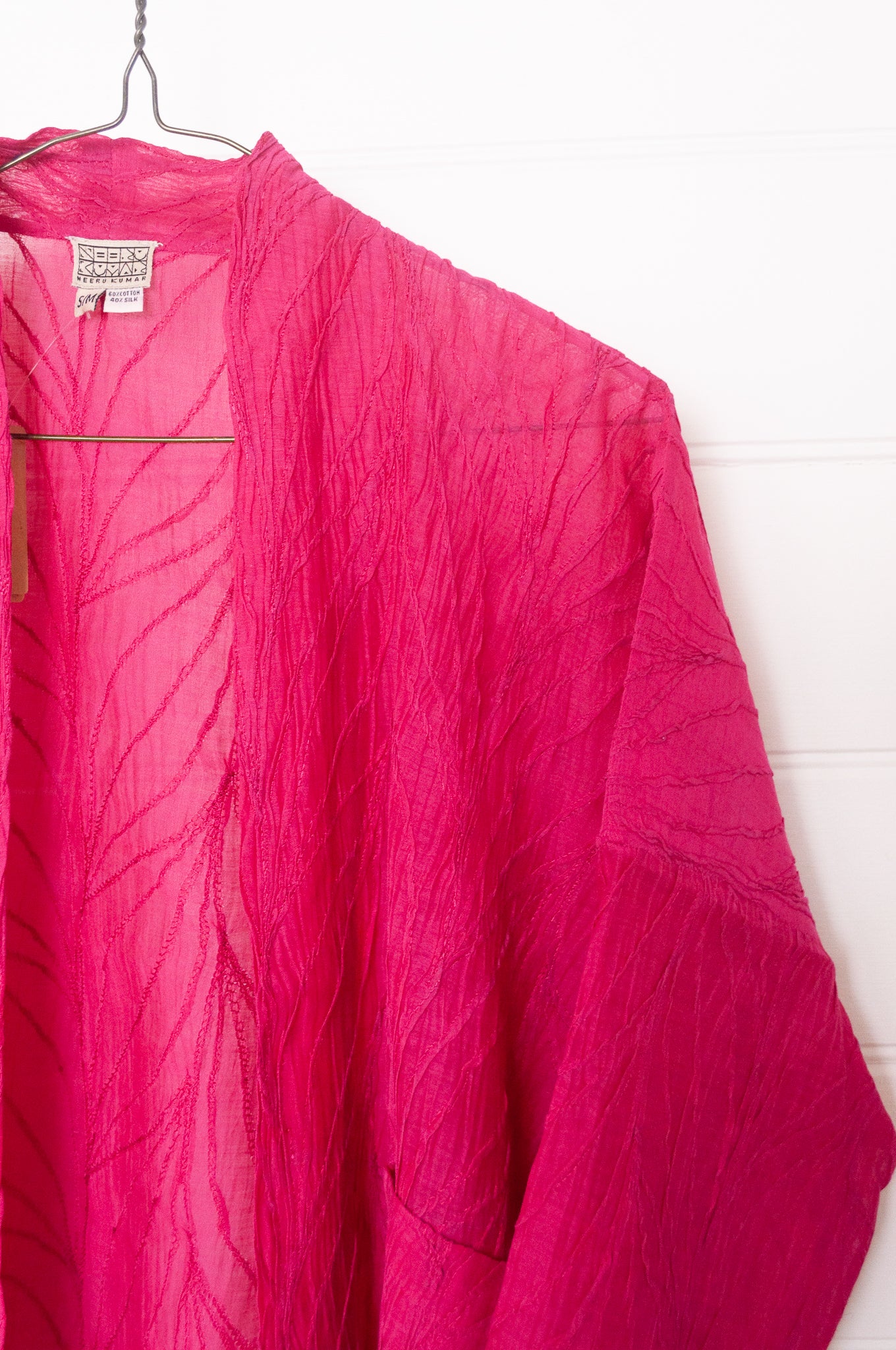 Classic Neeru Kumar cotton silk kimono jacket in bright magenta pink, embroidered and unlined.