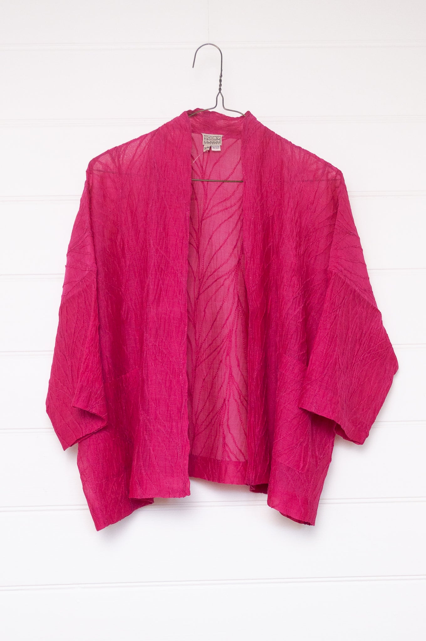 Classic Neeru Kumar cotton silk kimono jacket in bright magenta pink, embroidered and unlined.