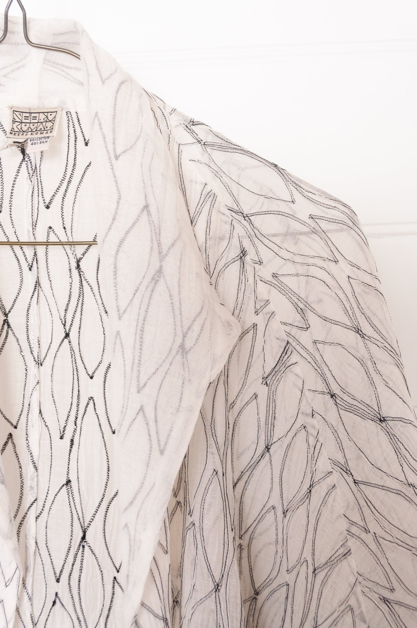 Classic Neeru Kumar cotton silk oversized kimono jacket in white, with black embroidery and unlined.