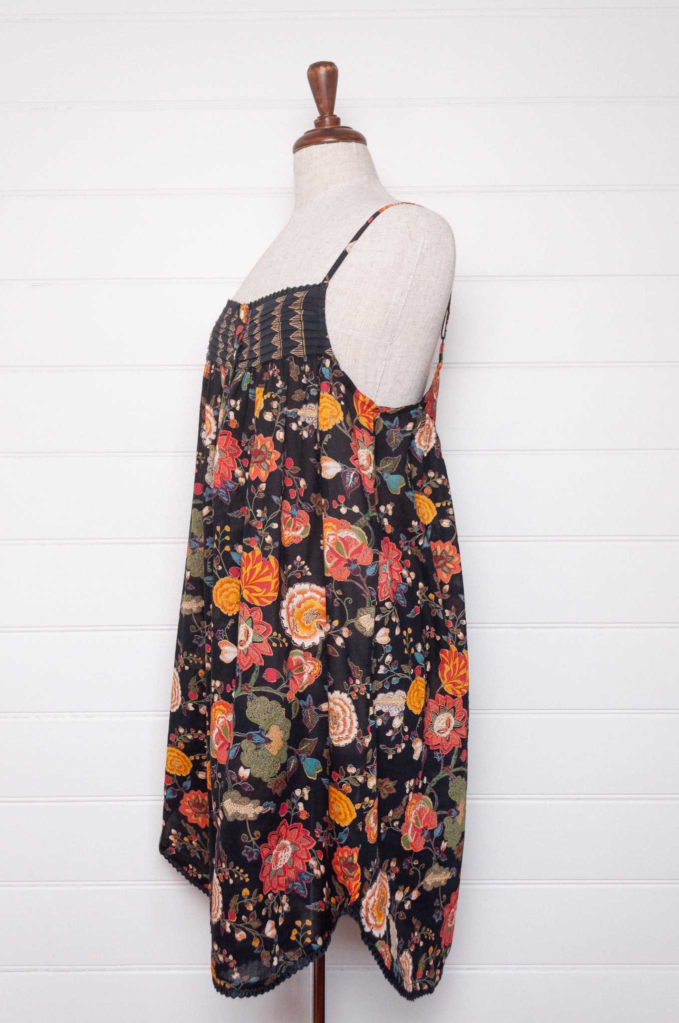 Juniper Hearth cotton voile nightdress in a vibrant all over tropical floral in coral, ecru and olive green on a black background