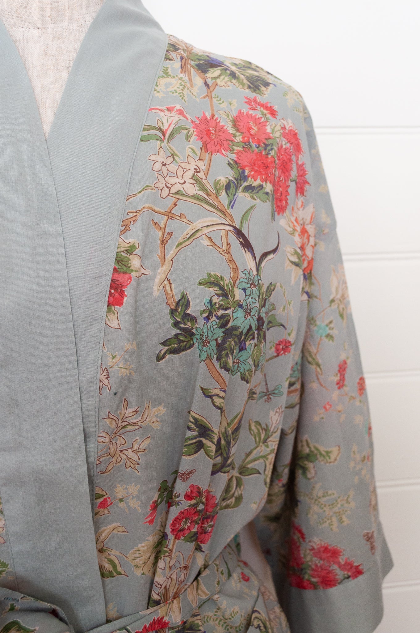 Juniper Hearth cotton voile kimono in country garden print, pink and vanilla flowers on duck egg blue background.