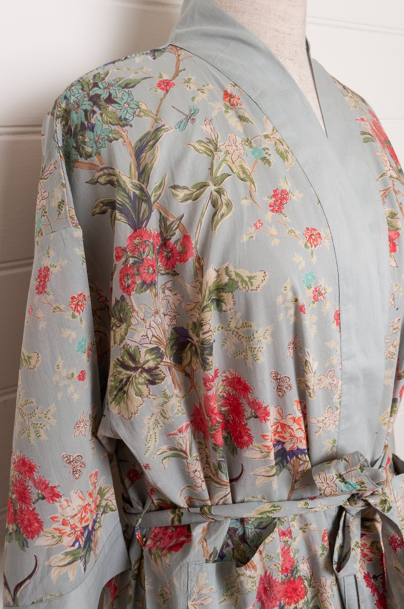 Juniper Hearth cotton voile kimono in country garden print, pink and vanilla flowers on duck egg blue background.