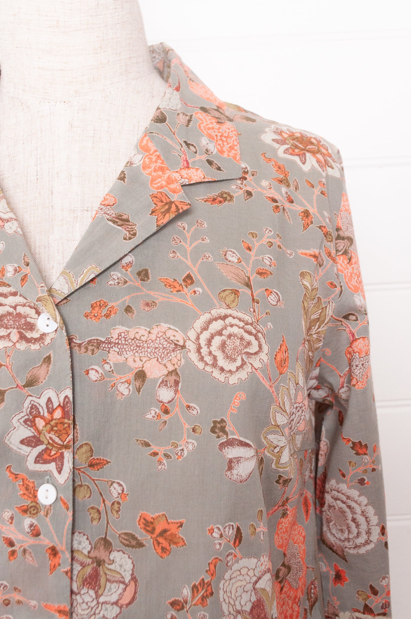 Juniper Hearth cotton voile pyjamas, screen printed with floral print on sage green background.