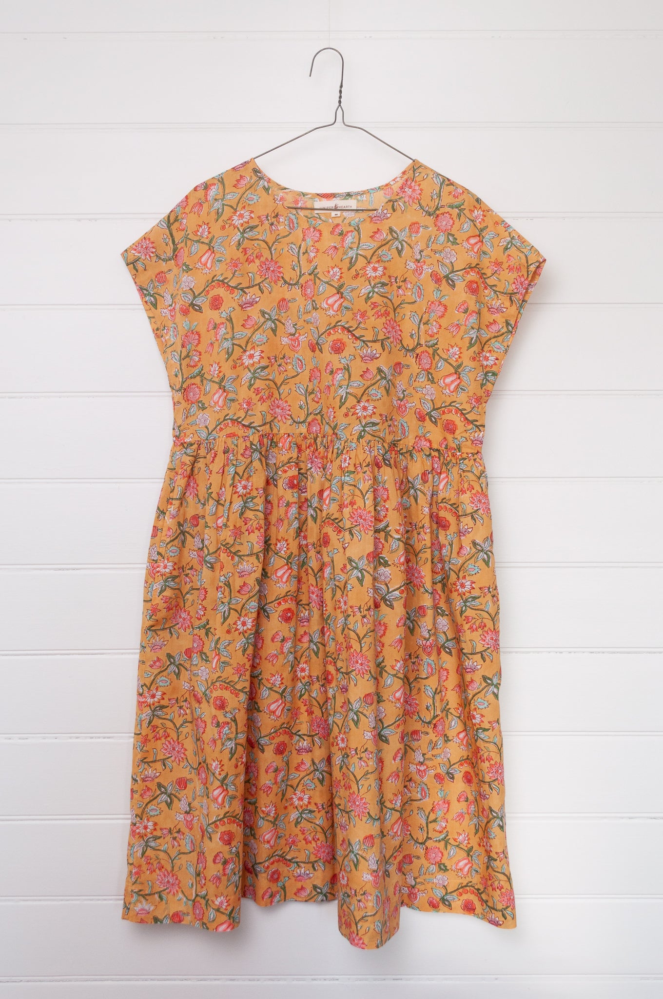 Juniper Hearth blockprint cotton dress with gathered skirt and pockets, in mustard floral.