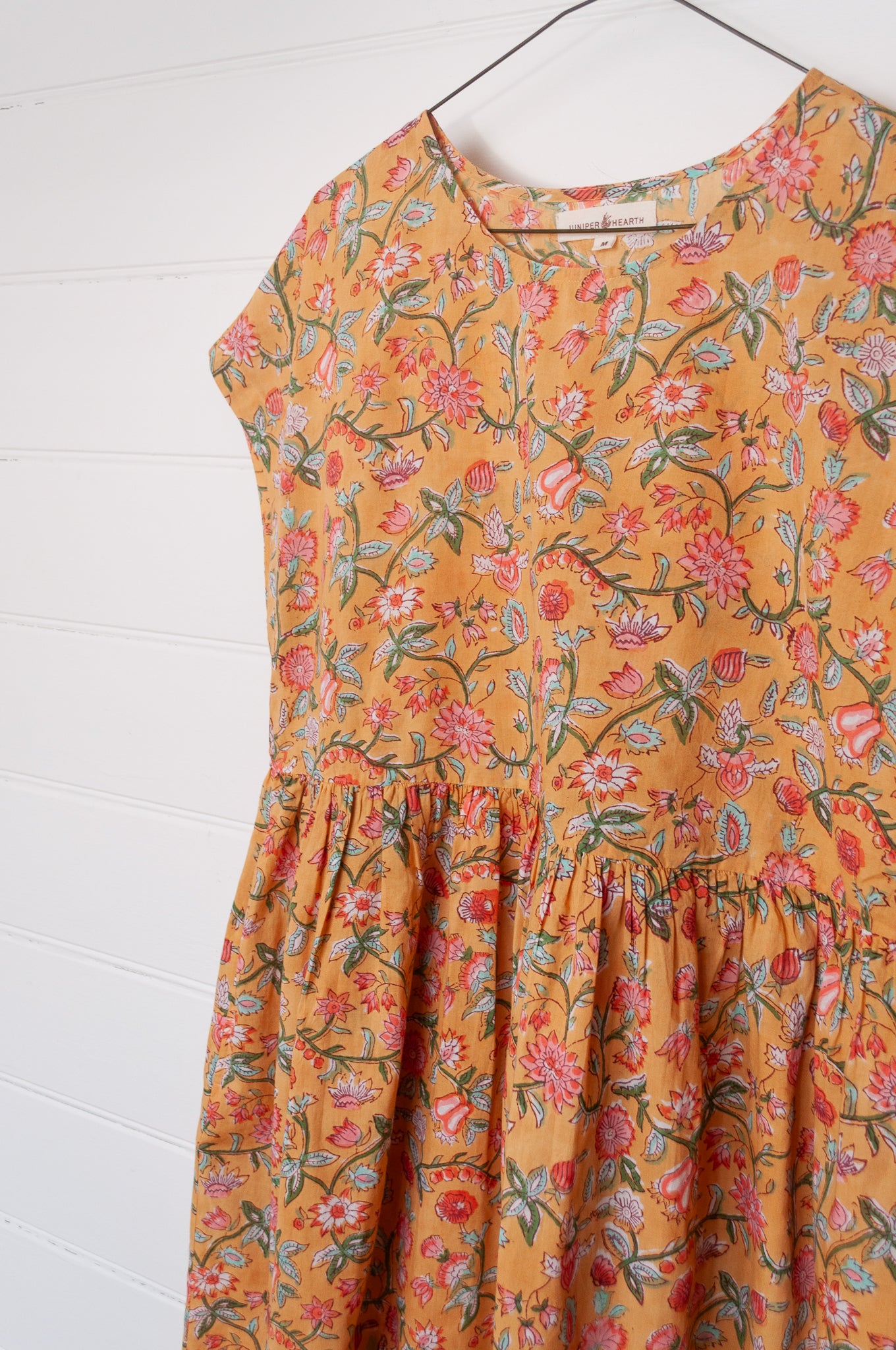 Juniper Hearth blockprint cotton dress with gathered skirt and pockets, in mustard floral.