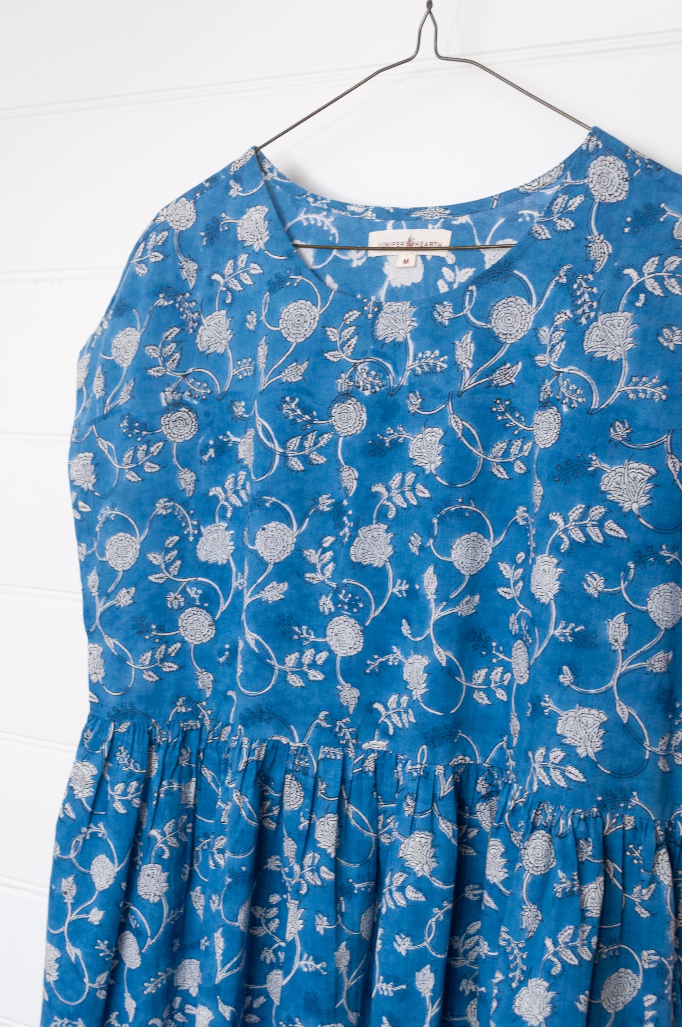 Juniper Hearth blockprint cotton dress with gathered skirt and pockets, in blue and white floral.