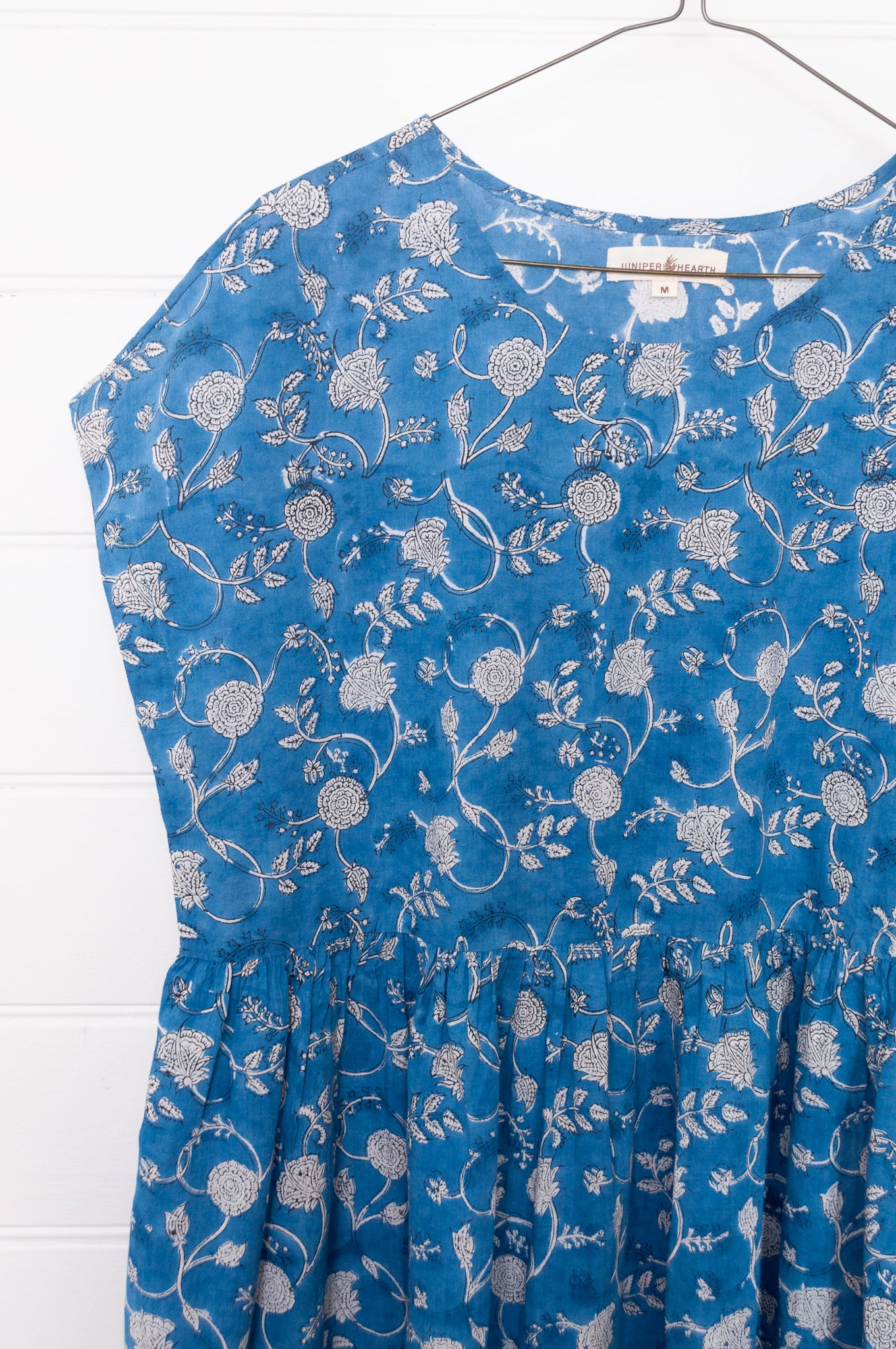 Juniper Hearth blockprint cotton dress with gathered skirt and pockets, in blue and white floral.