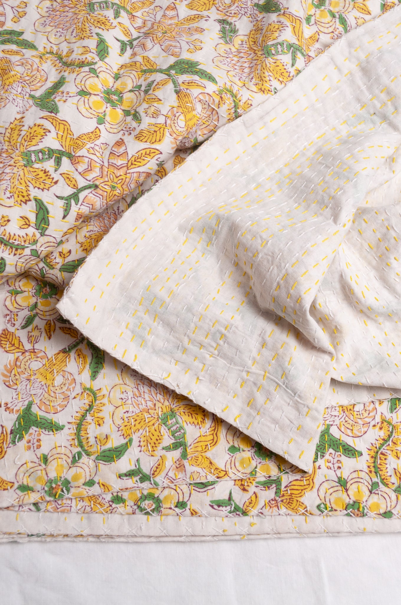 Hand stitched block print pure cotton kantha quilt lemon yellow pink and green floral.