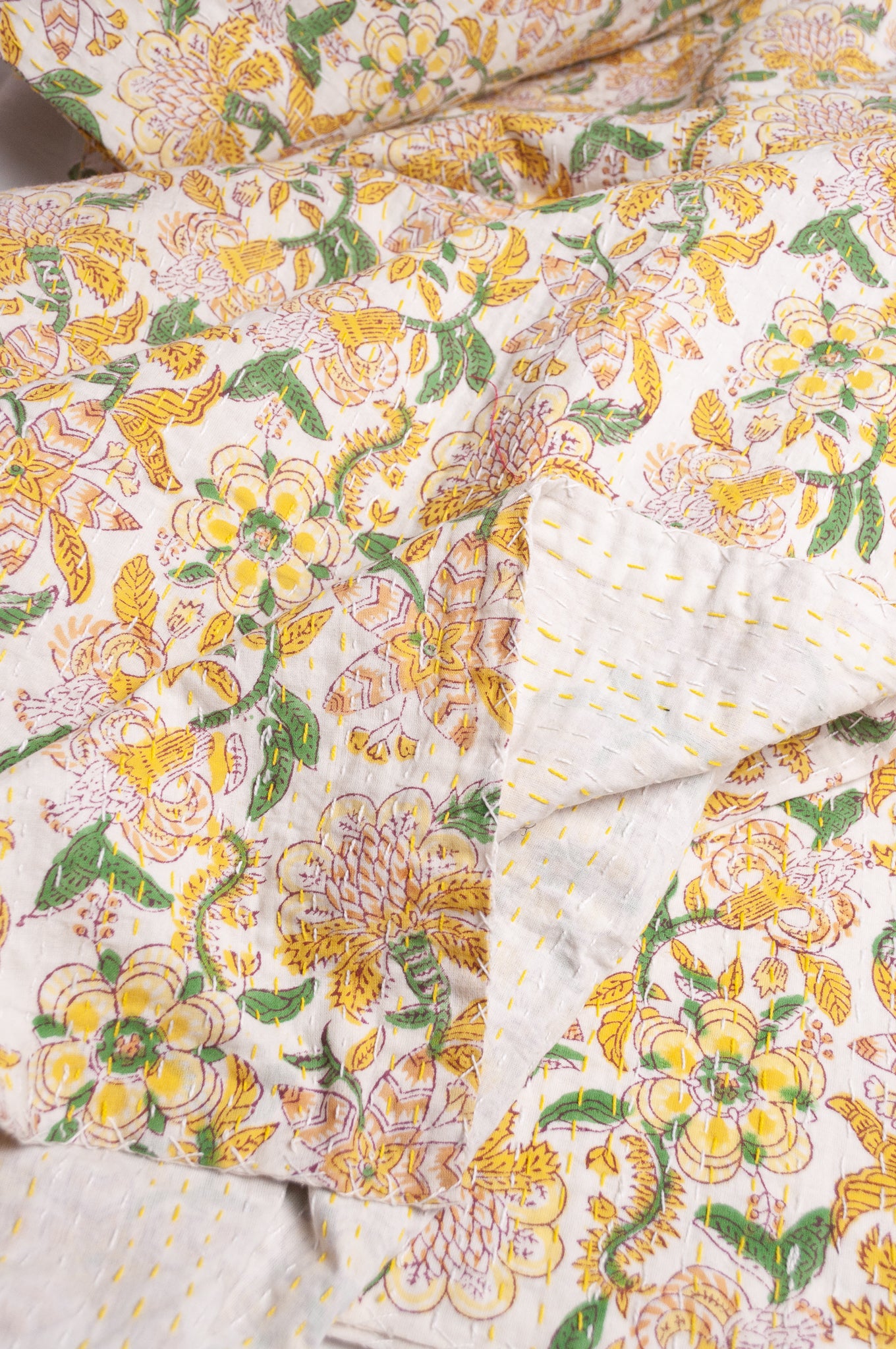 Hand stitched block print pure cotton kantha quilt lemon yellow pink and green floral.