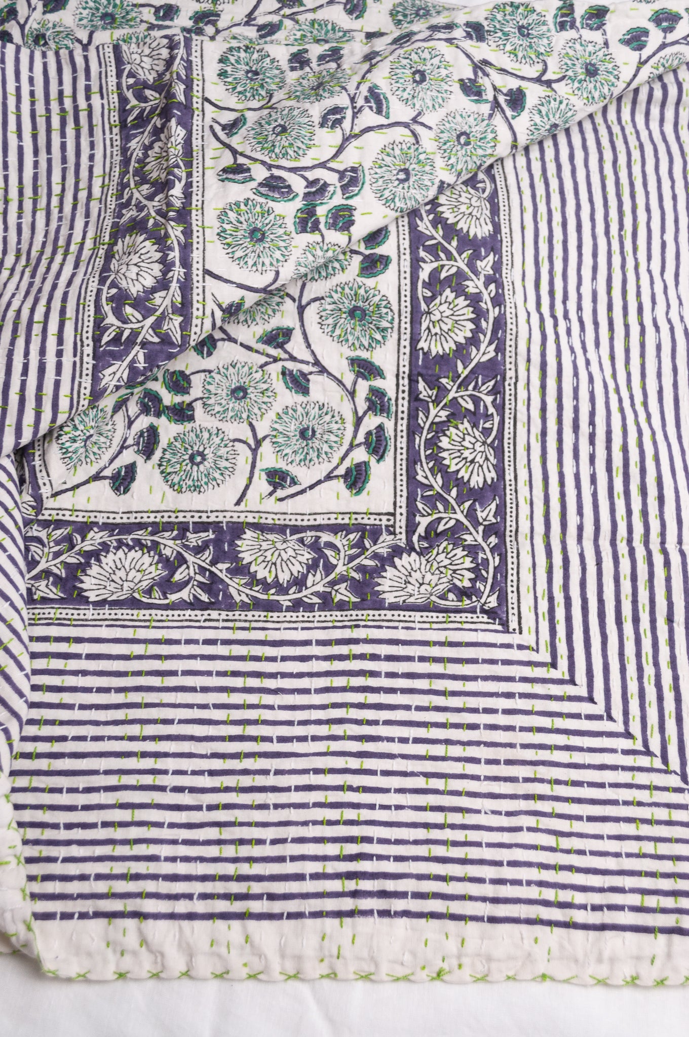 Hand stitched block print pure cotton kantha quilt mint green and indigo blue floral and vine on white.