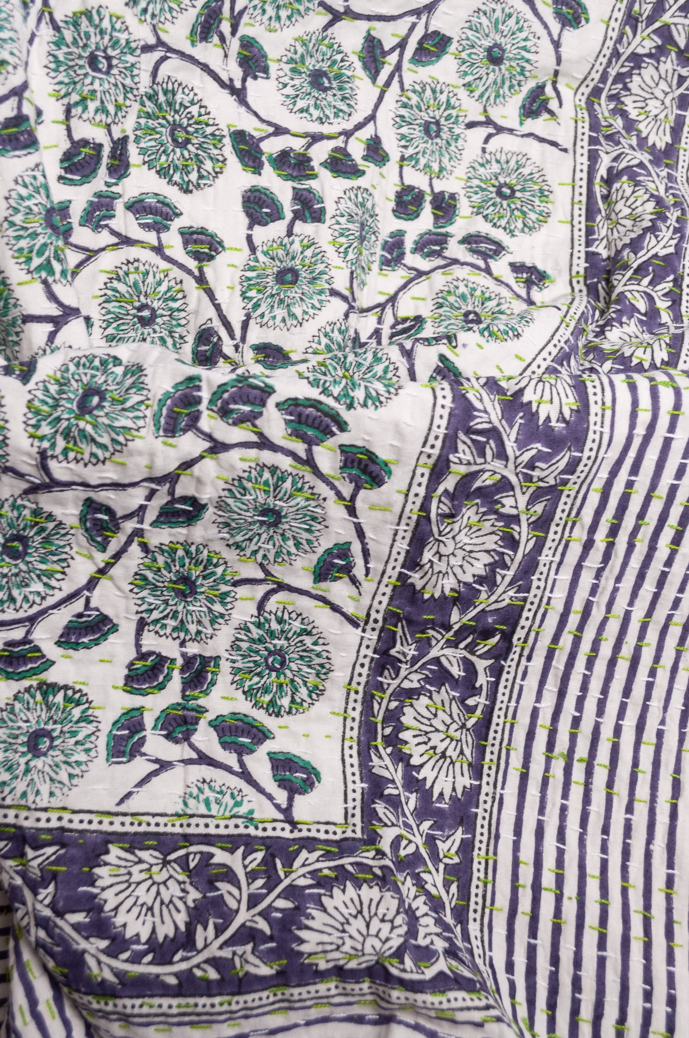 Hand stitched block print pure cotton kantha quilt mint green and indigo blue floral and vine on white.