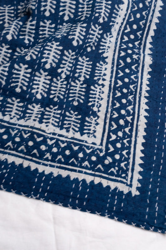 Indigo and white blockprint bhuti design handstitched cotton kantha quilt.