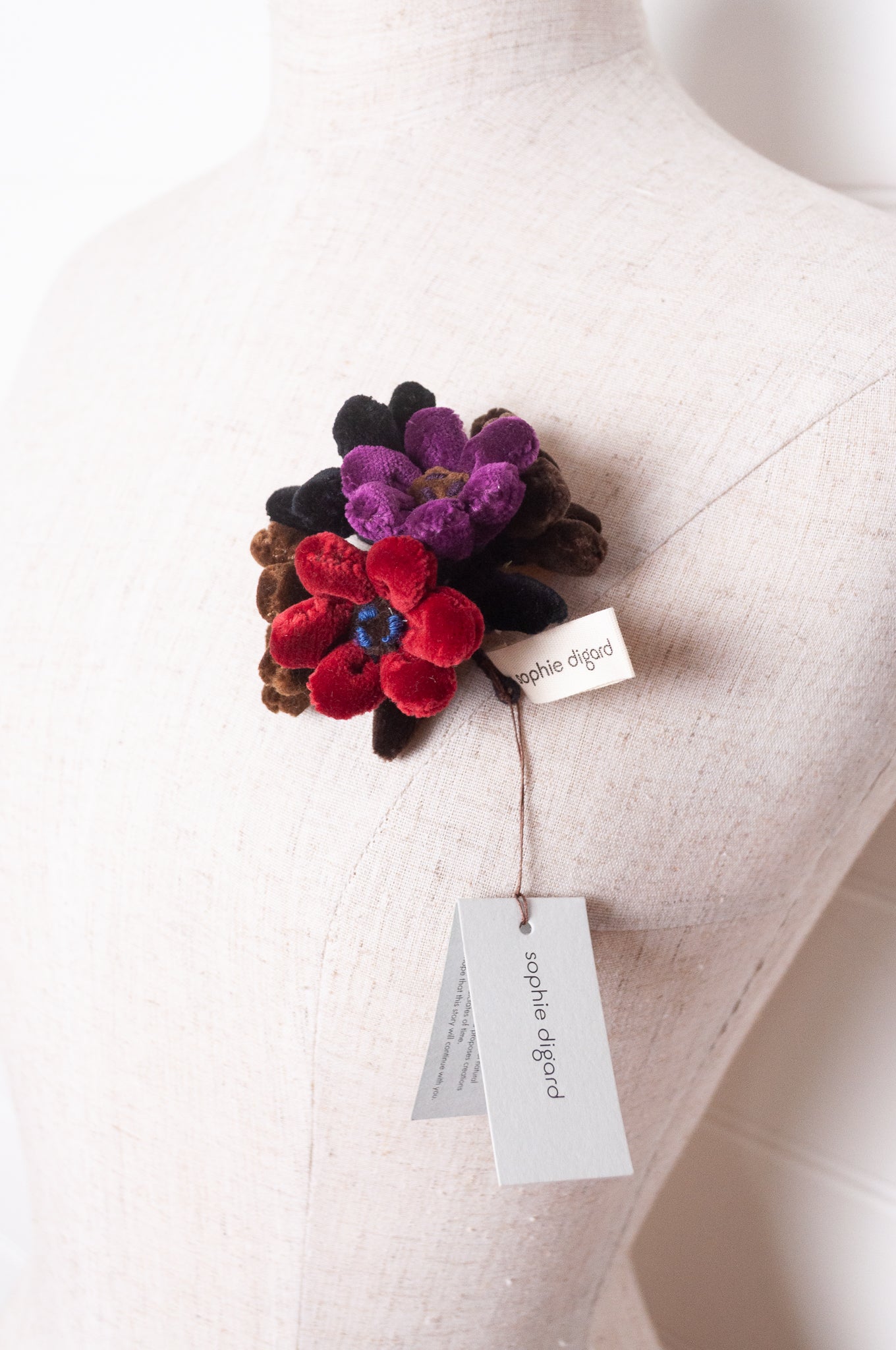 Sophie Digard velour flower jonquille brooch in deep wintery tones.