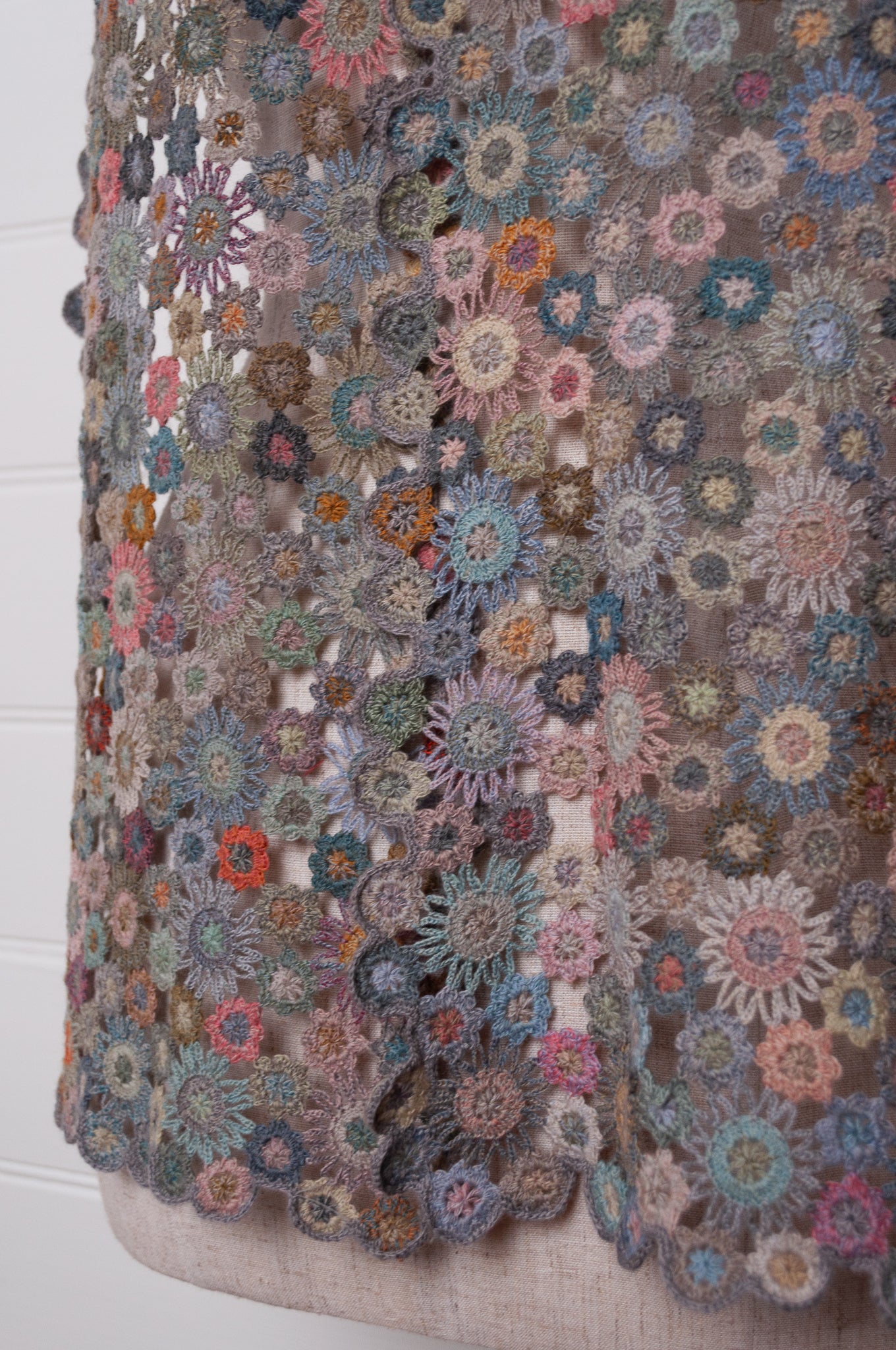 Sophie Digard fleurs etoilees star flower crochet scarf in soft palette of mauves and pinks.