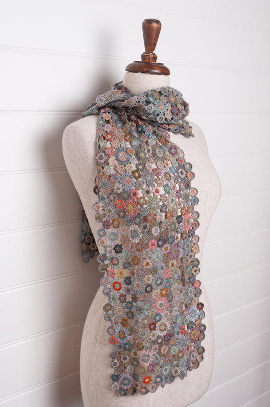Sophie Digard fleurs etoilees star flower crochet scarf in soft palette of mauves and pinks.