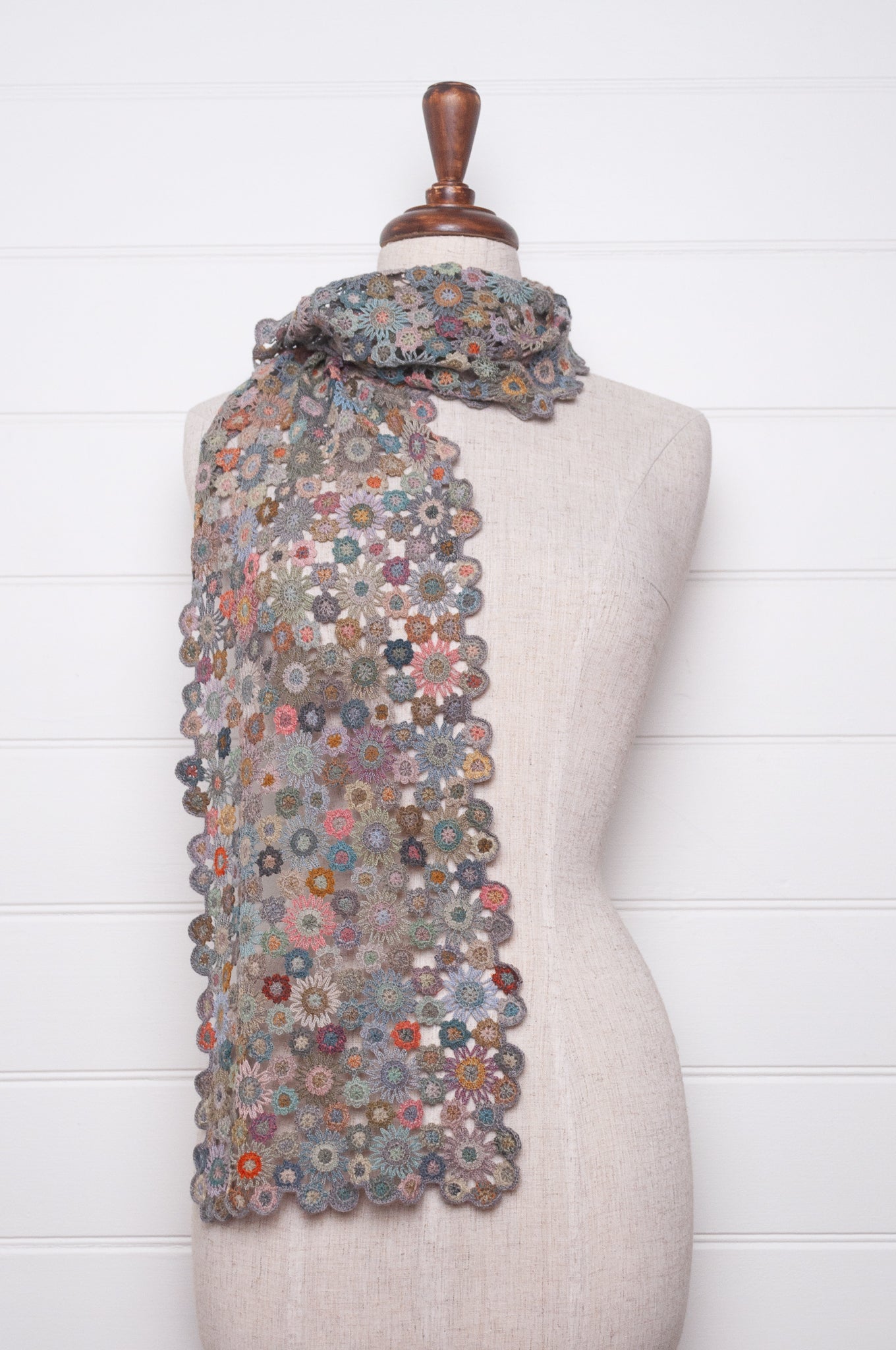 Sophie Digard fleurs etoilees star flower crochet scarf in soft palette of mauves and pinks.