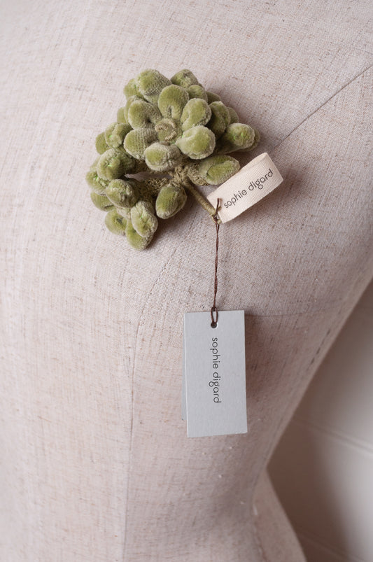 Sophie Digard velour flower jonquille brooch in soft sage green.