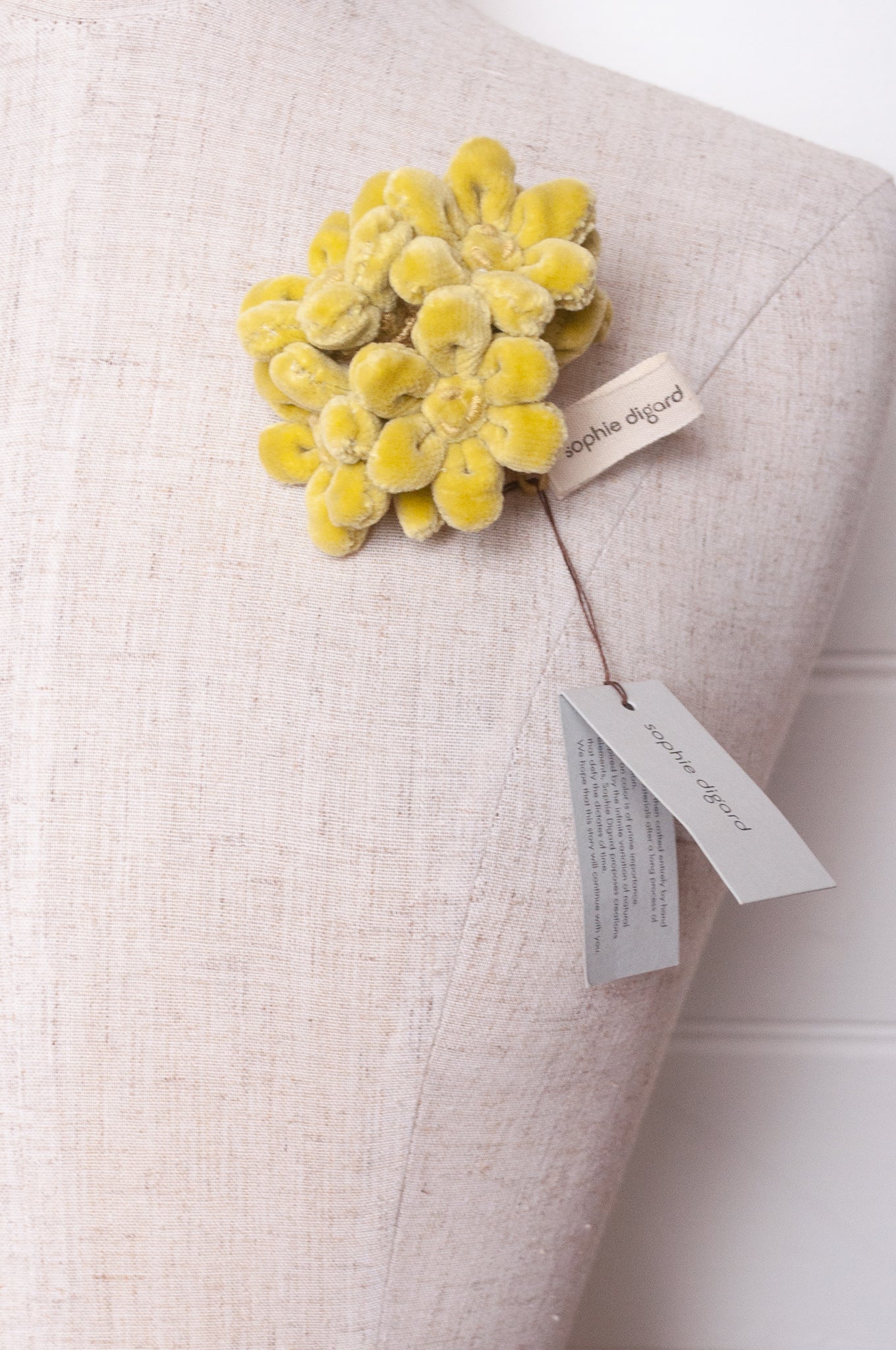 Sophie Digard velvet jonquille brooch in lime green.