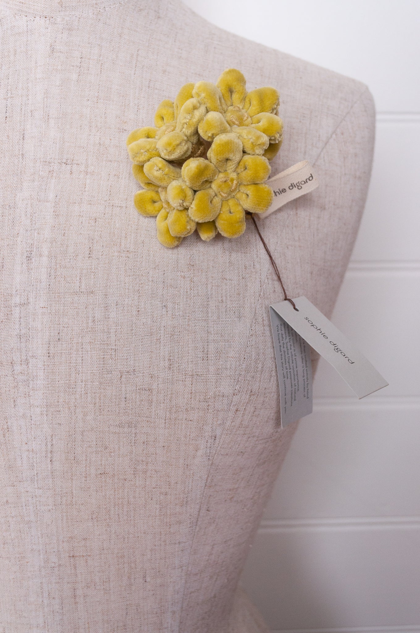 Sophie Digard velvet jonquille brooch in lime green.