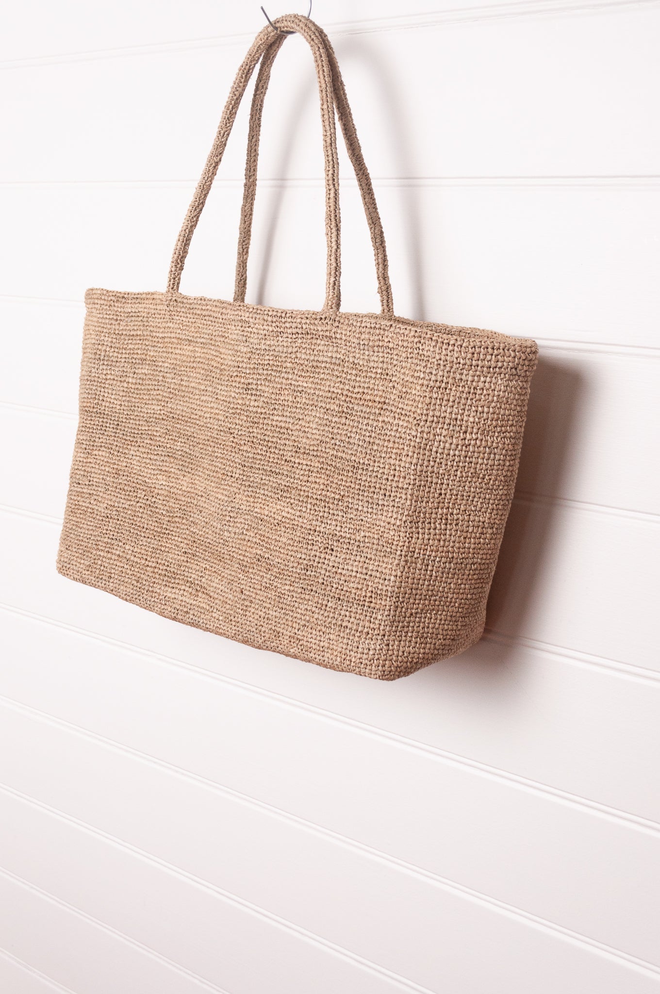 Sophie Digard plain shoulder tote bag in natural toned crocheted raffia.