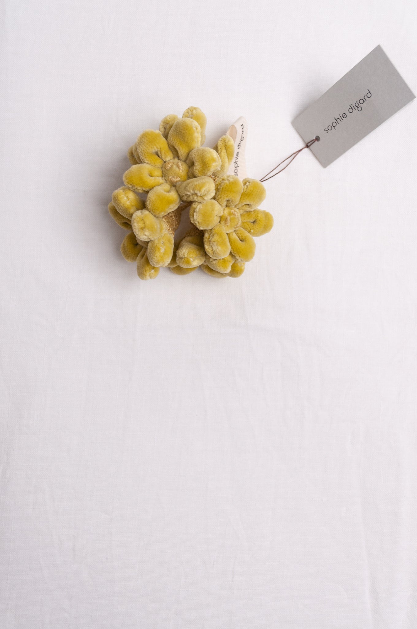 Sophie Digard velvet jonquille brooch in lime green.