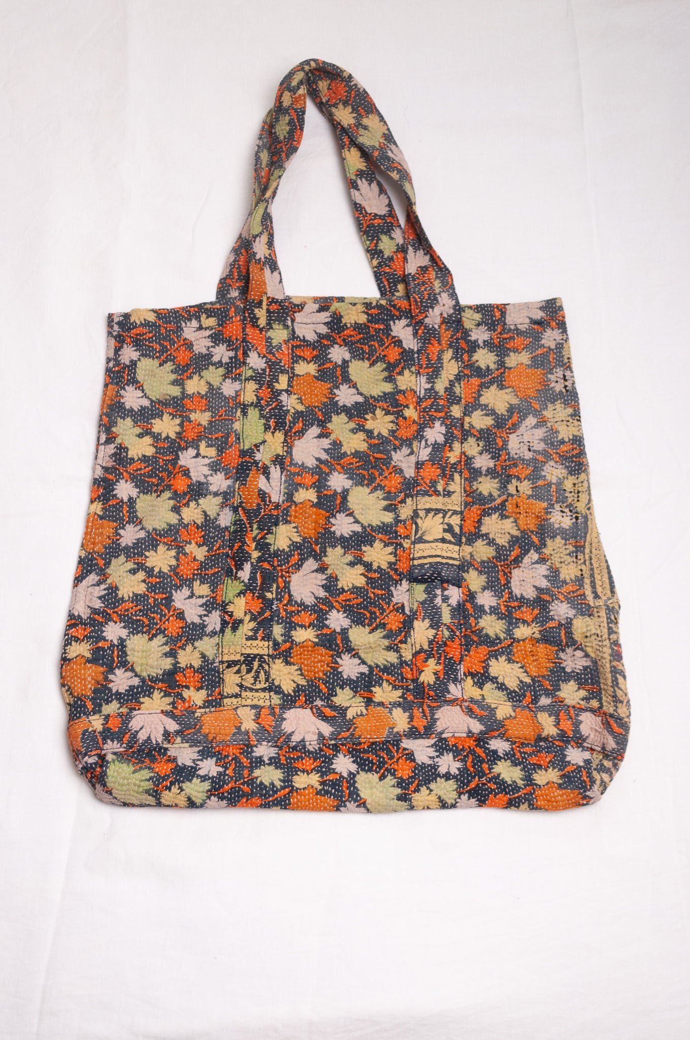 Vintage kantha quilt tote bag in autumn leaves pattern.