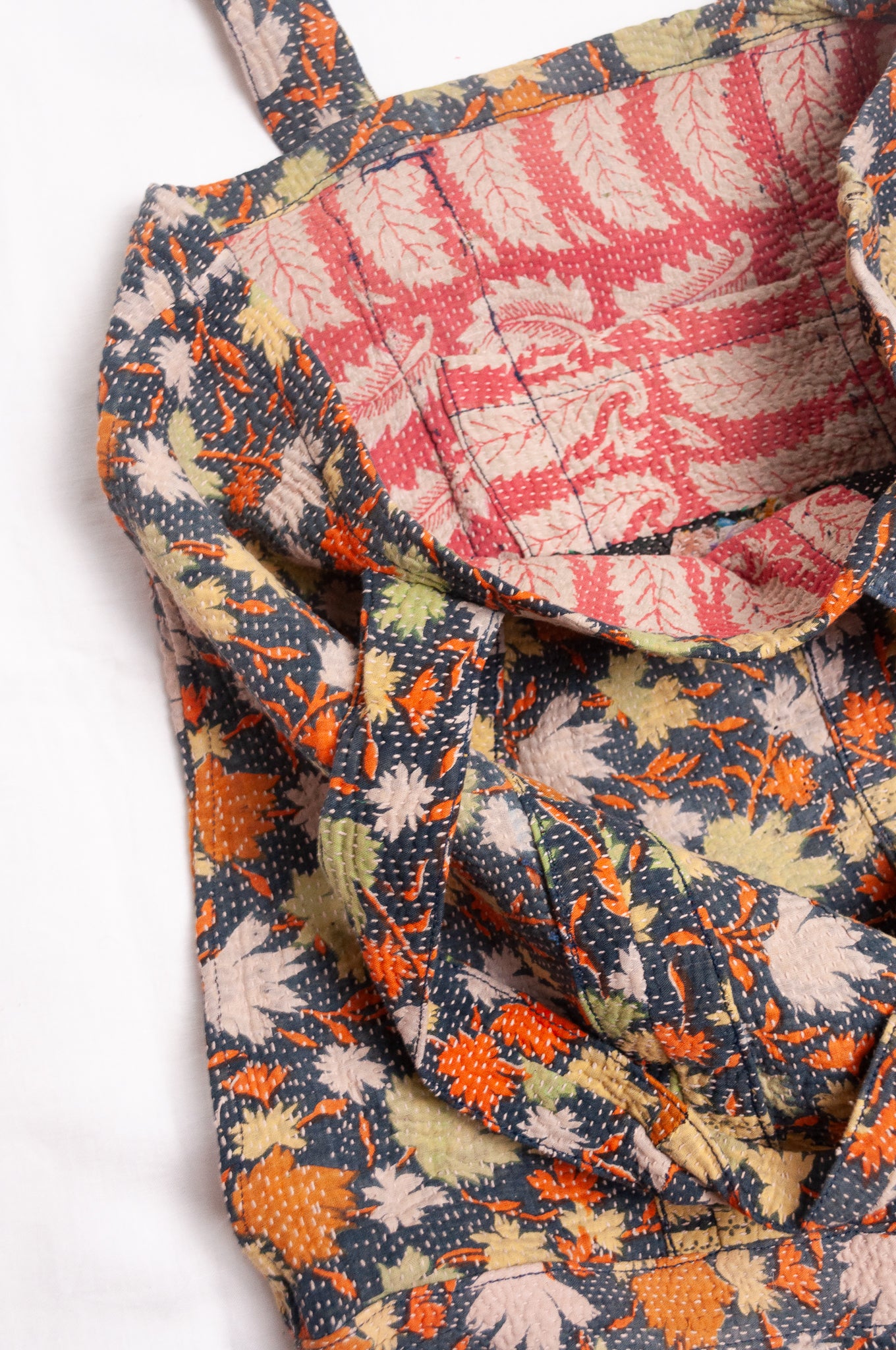 Vintage kantha quilt tote bag in autumn leaves pattern.