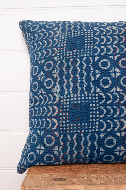 Vintage indigo kantha cushion overdyed with patchwork print.