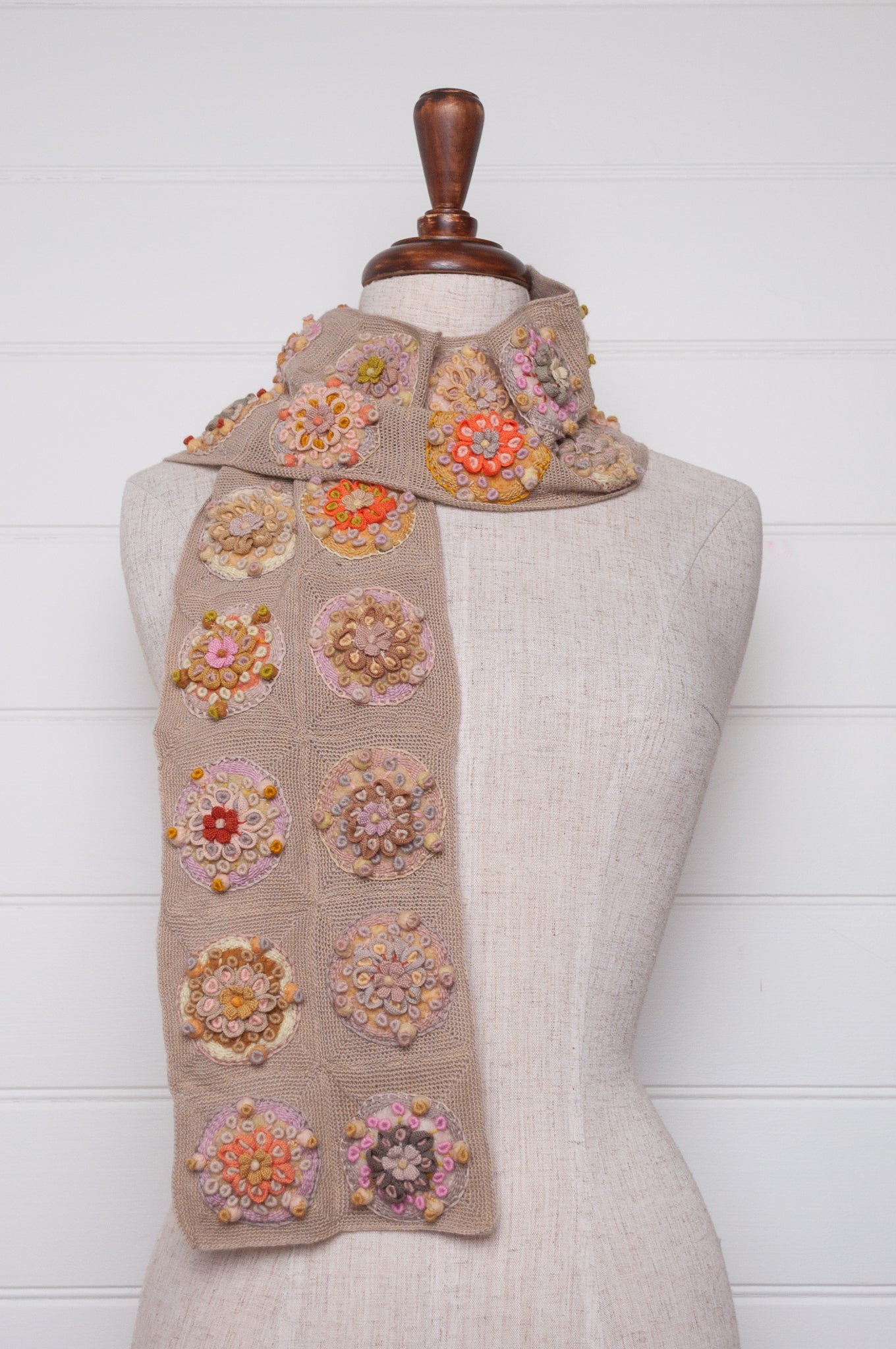 Sophie Digard crocheted scarf with embroidered and crocheted medallions in warm neutral tones.