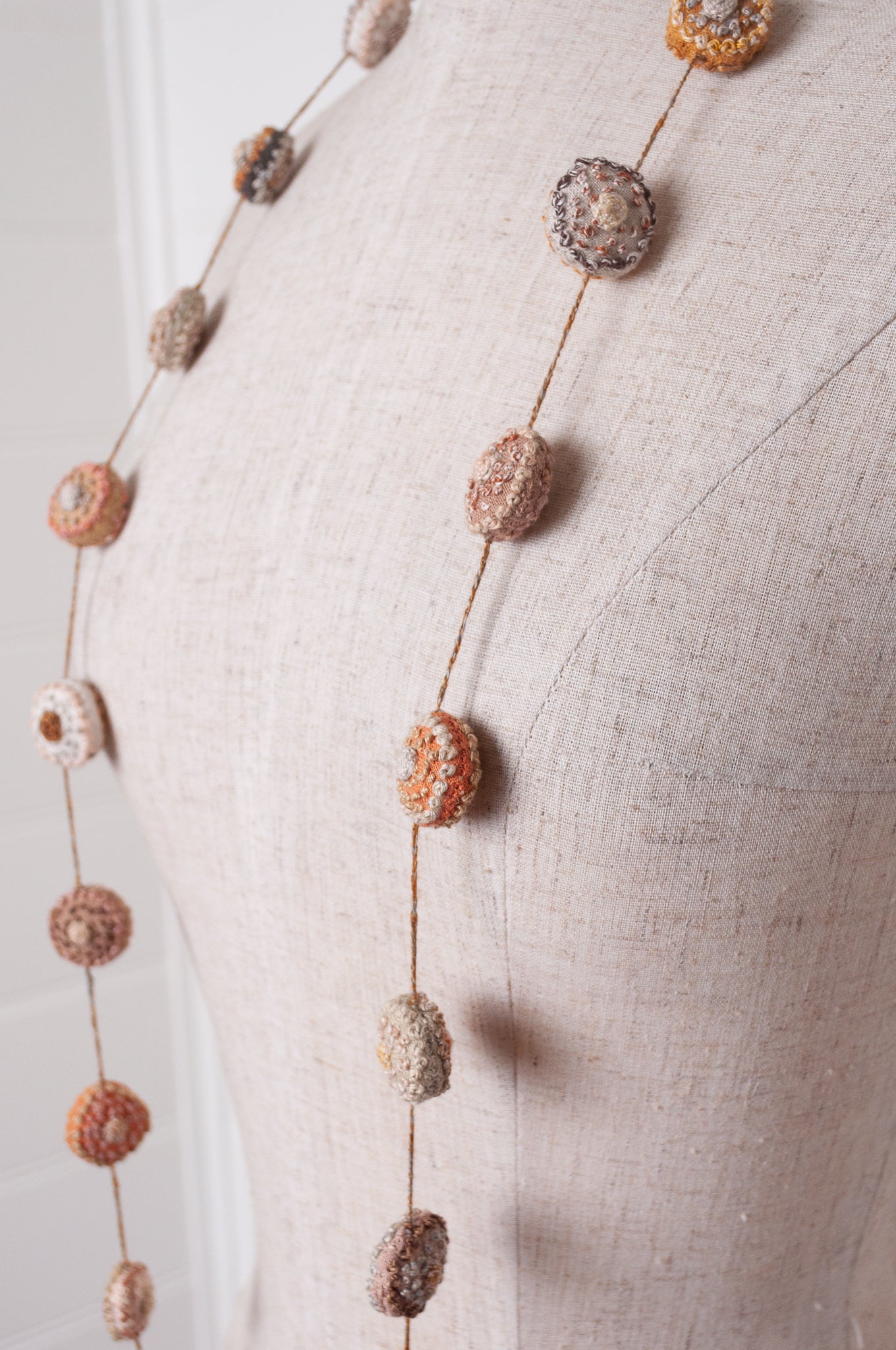 Sophie Digard embroidered linen medallions necklace in warm neutrals.