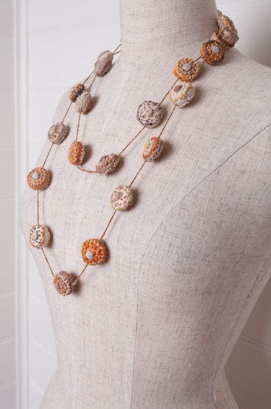 Sophie Digard embroidered linen medallions necklace in warm neutrals.