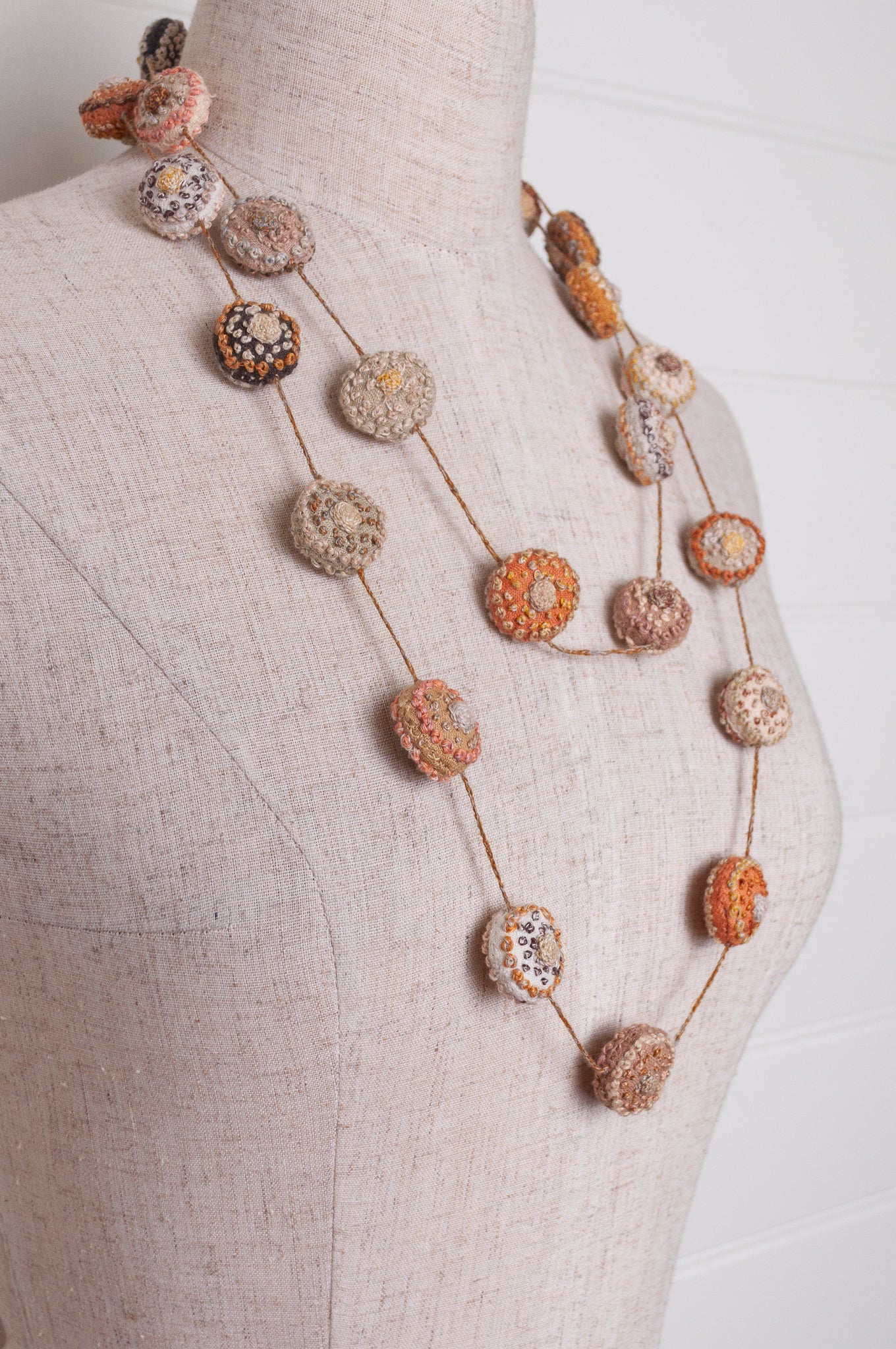 Sophie Digard embroidered linen medallions necklace in warm neutrals.