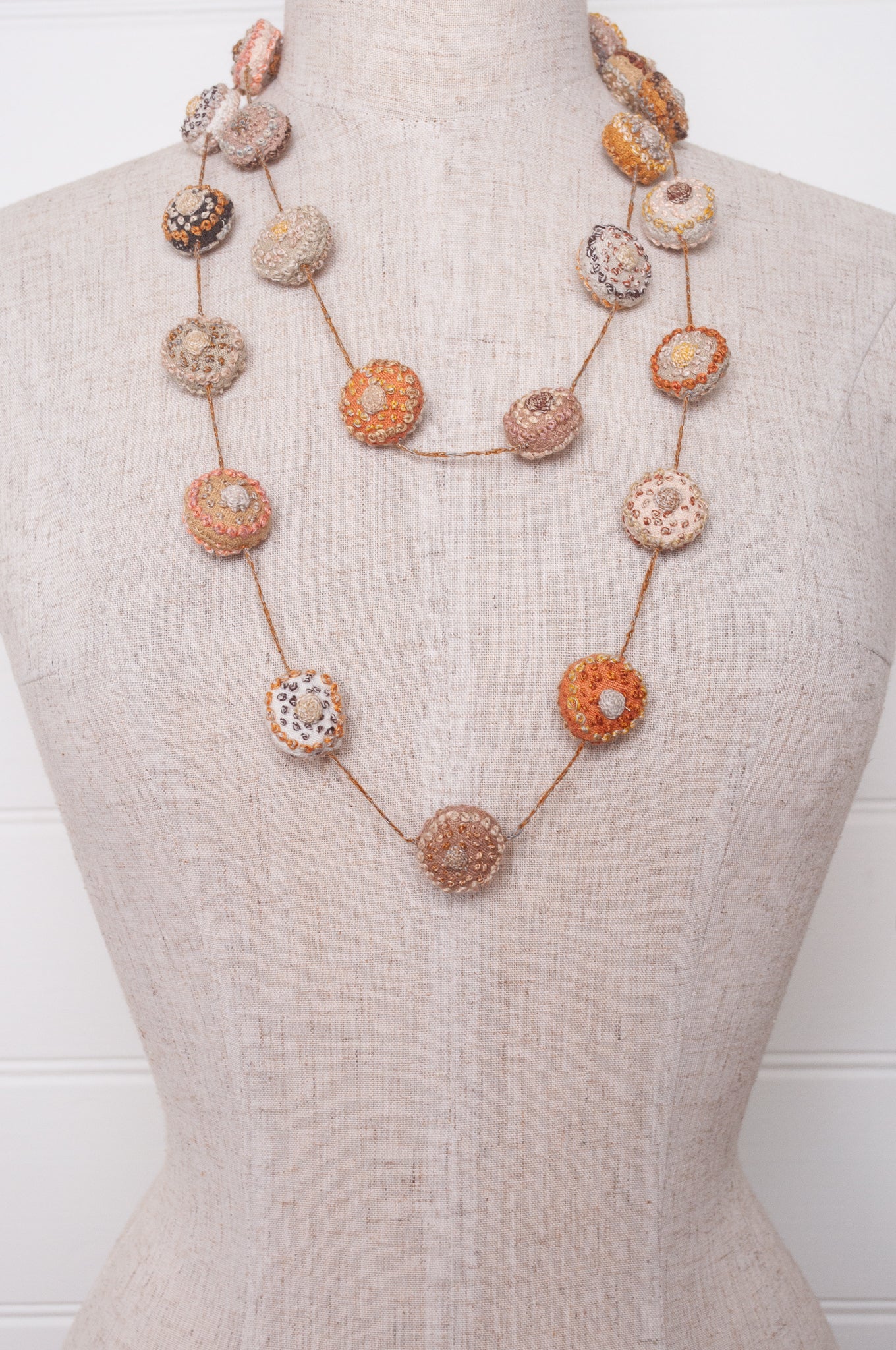 Sophie Digard embroidered linen medallions necklace in warm neutrals.