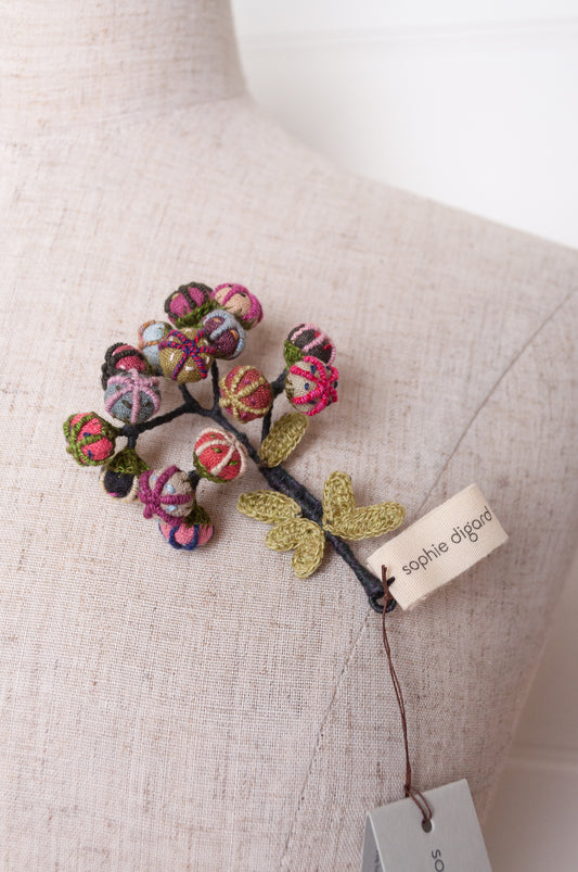 Handcrafted brooch by Sophie Digard, featuring small embroidered button flowers in linen.
