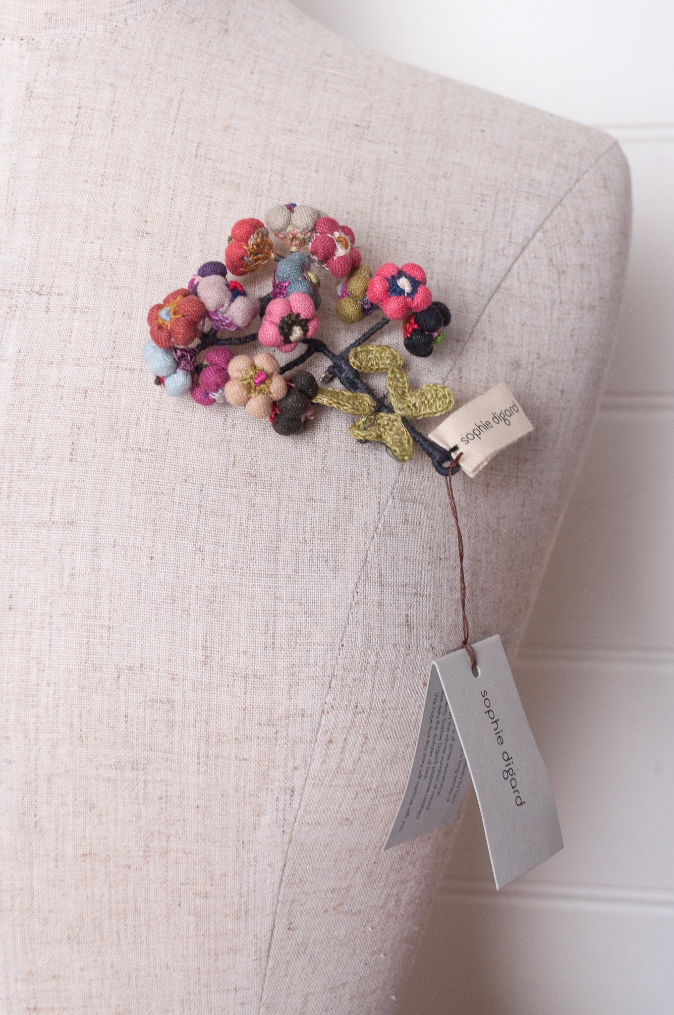 Sophie Digard colourful button flower brooch hand embroidered and crocheted in linen.